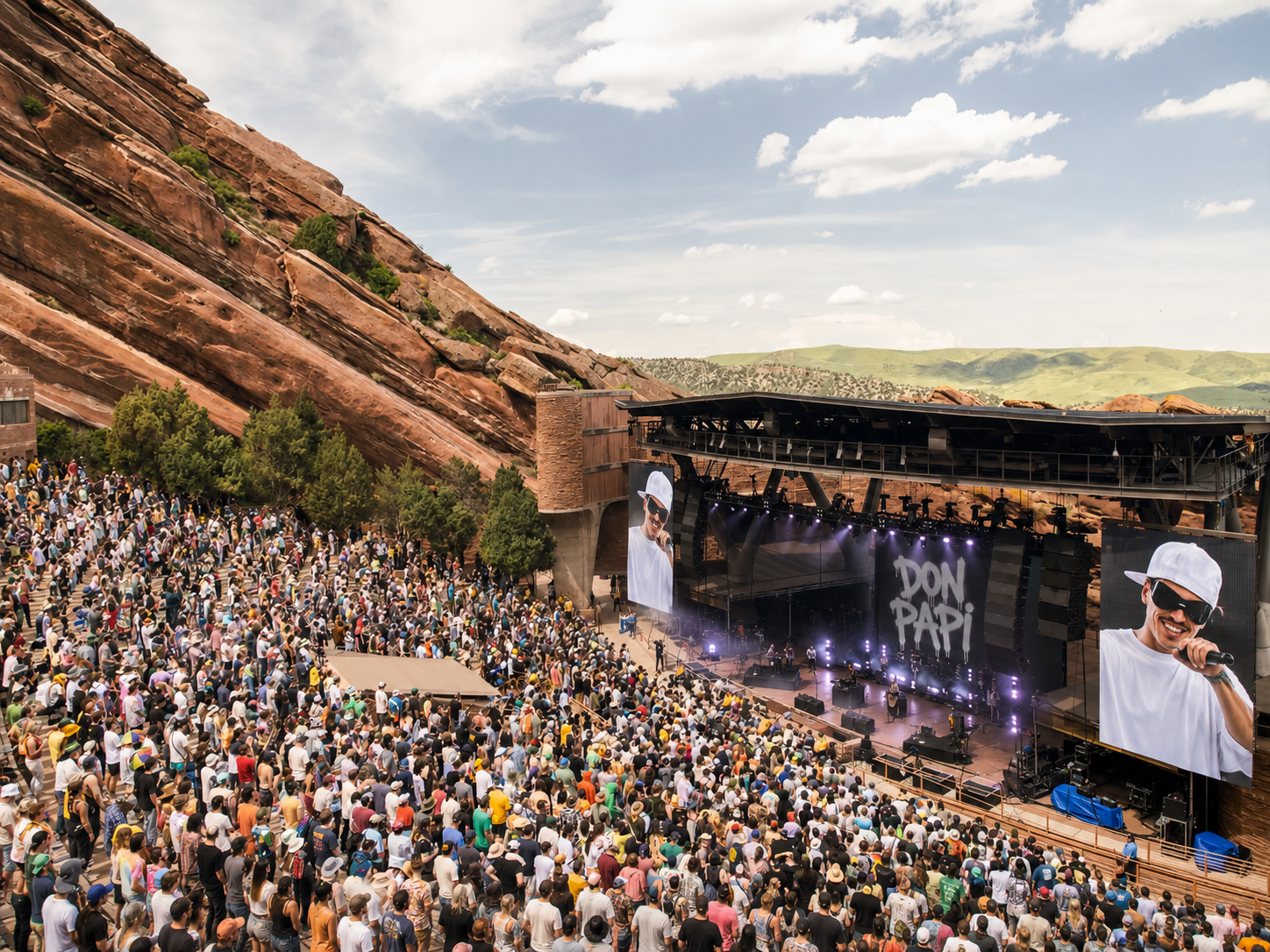 Don Papi performing at a packed outdoor amphitheatre